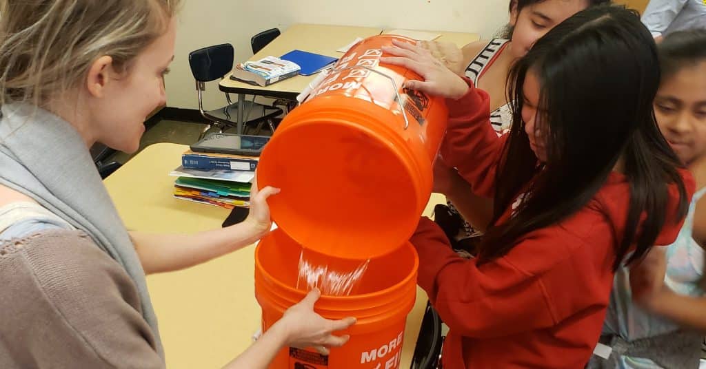 Engineer doing a STEM activity with elementary school children.