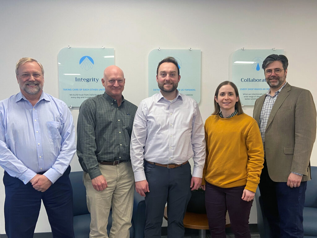 Water resources team members Mark Forest, David Johnson, Sam Smith, Erin Krug, and Zak Toledo gather for team building meeting.