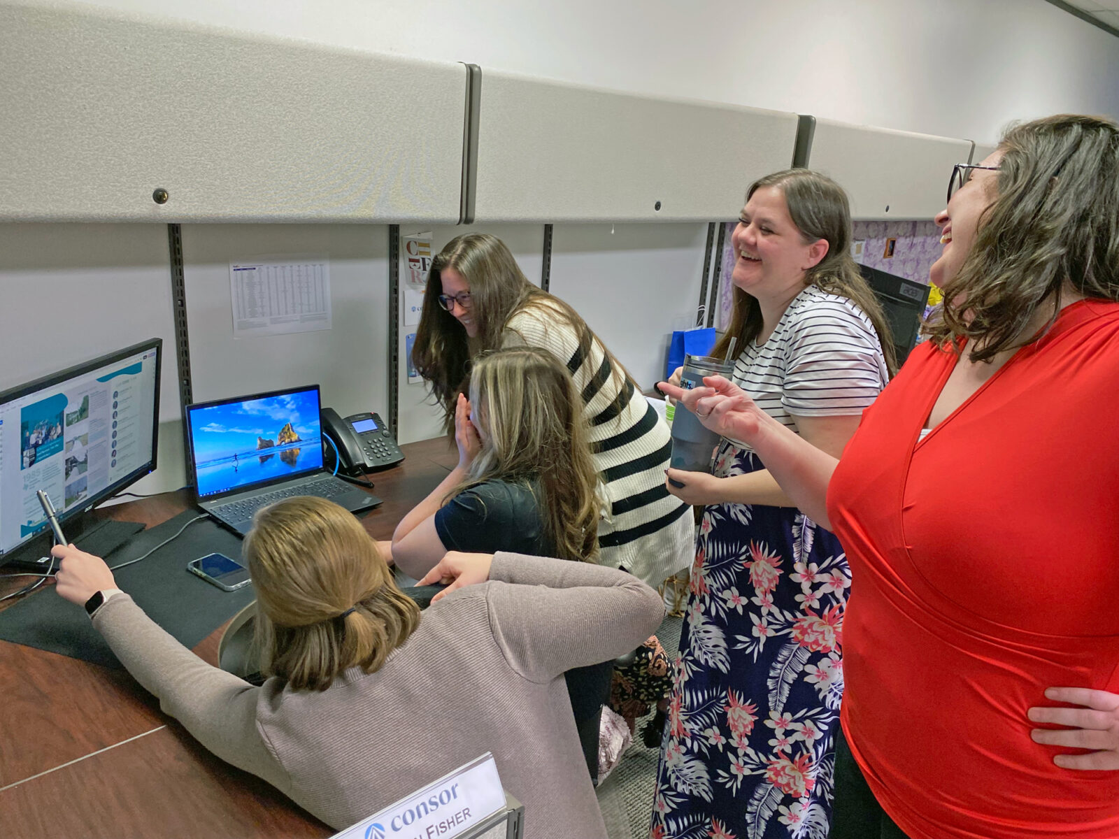 Sharing laughs while working together in the Houston office!